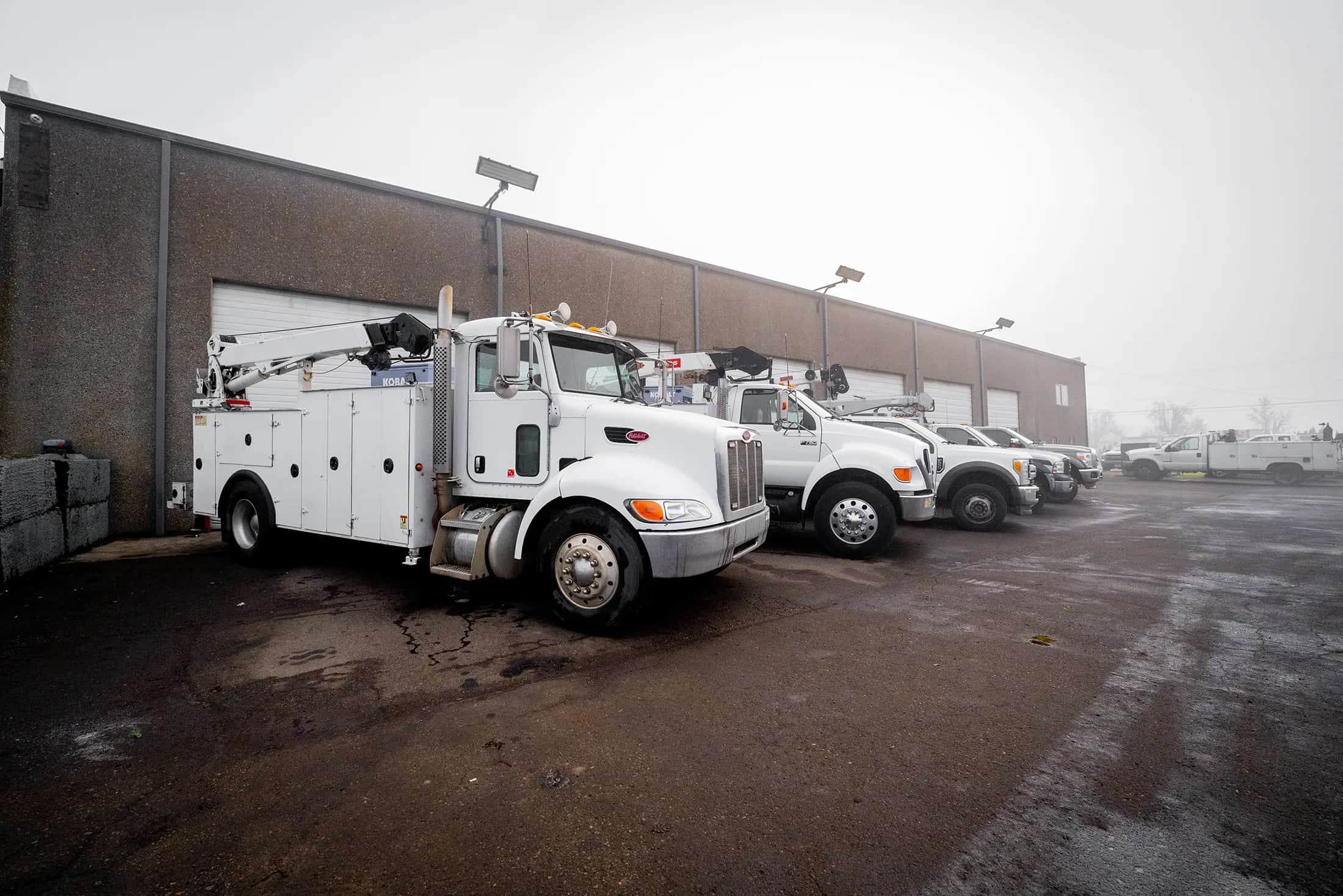 Service truck at the roadside with a technician on scene